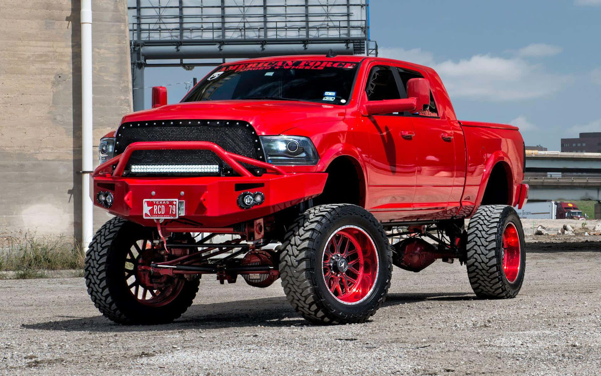 Jacked Up Trucks With Red Rims Background