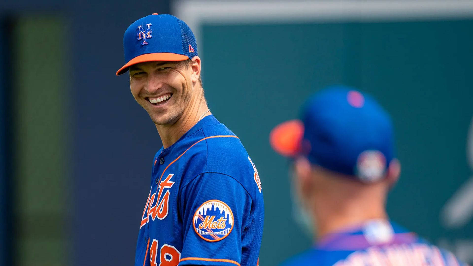 Jacob Degrom Flaunting A Smile Background