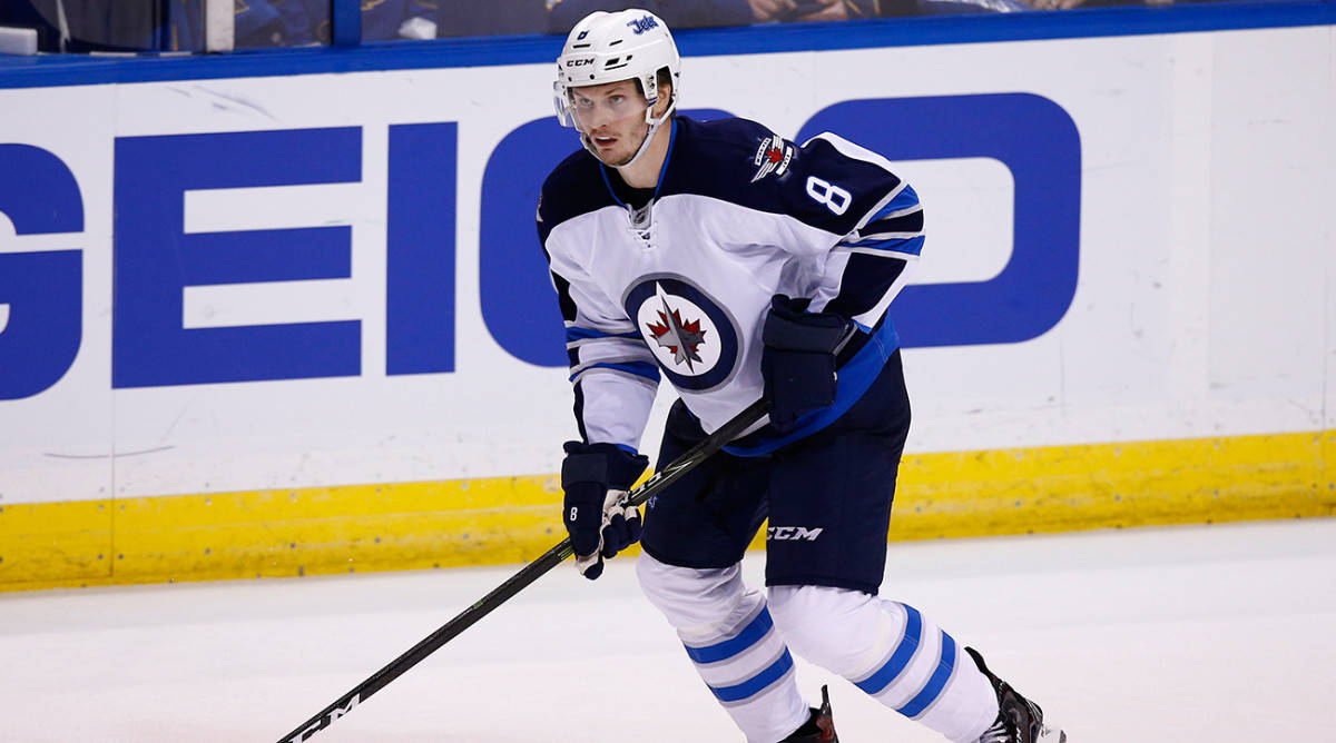 Jacob Trouba From Winnipeg Jets Gliding On Ice During Game Background