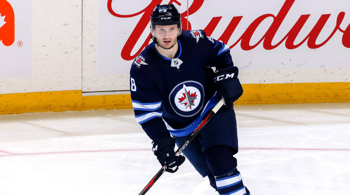 Jacob Trouba Fully Engaged On The Ice Background