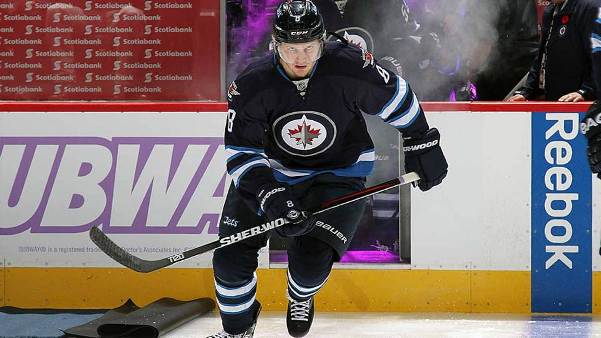 Jacob Trouba Gliding During Game While Holding Hockey Stick Background