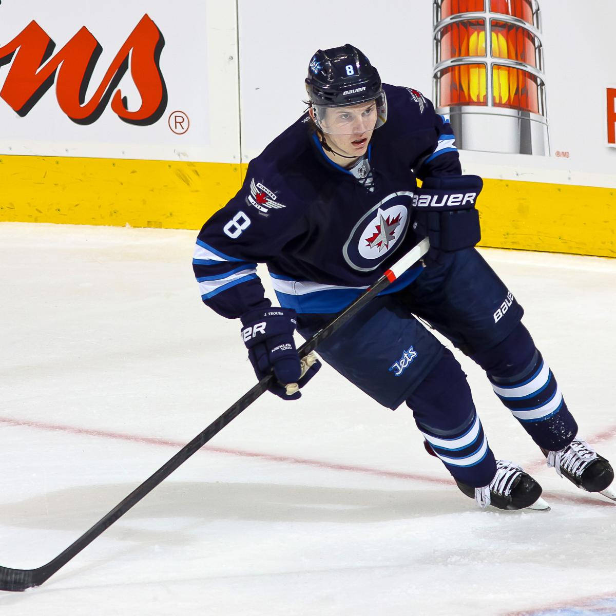 Jacob Trouba Leaning To The Right While Holding Hockey Stick Background