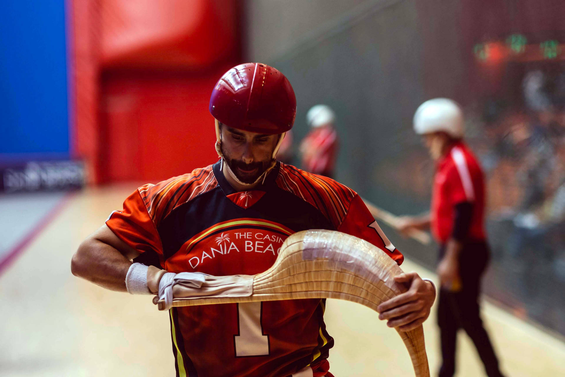 Jai Alai Player Adjusting His Cesta Background