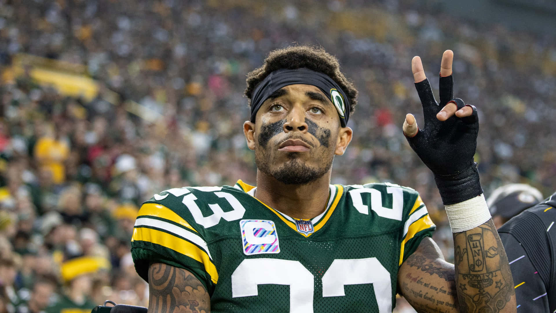 Jaire Alexander Peace Sign On Field Background