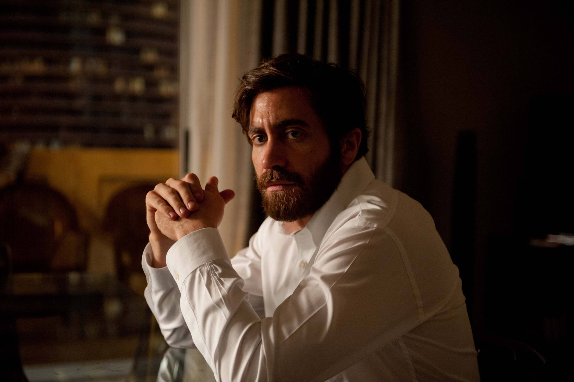 Jake Gyllenhaal Agitated Look Background