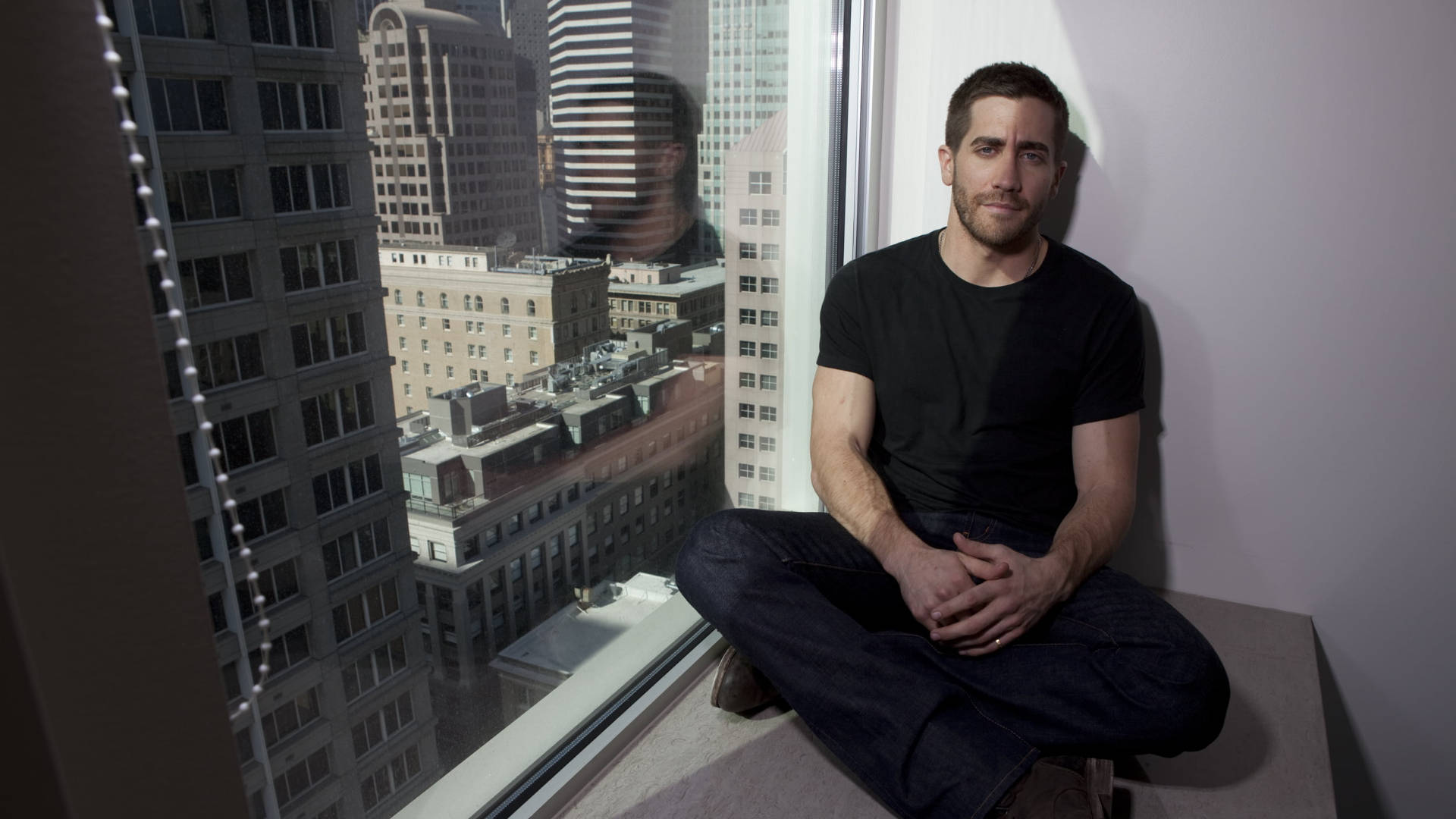 Jake Gyllenhaal By The Window Background
