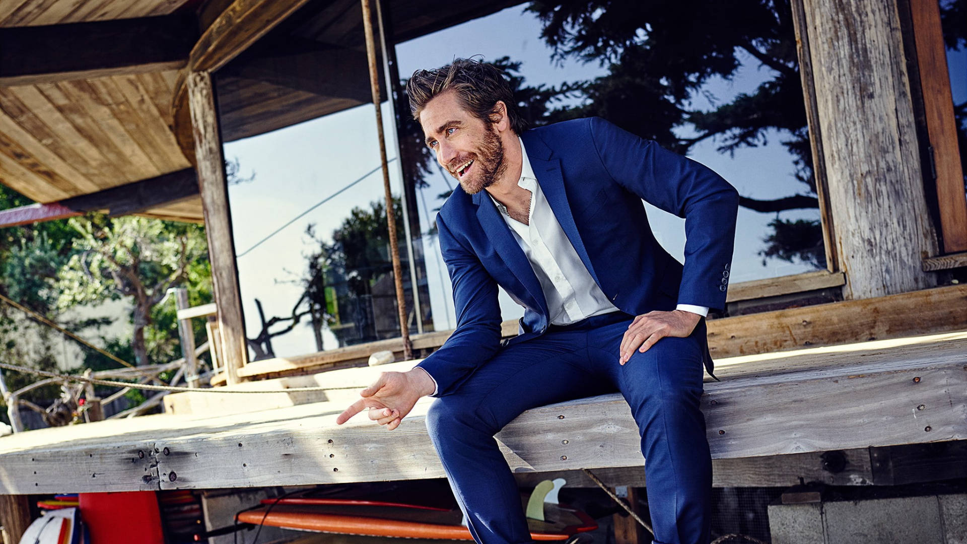 Jake Gyllenhaal In Blue Suit Background