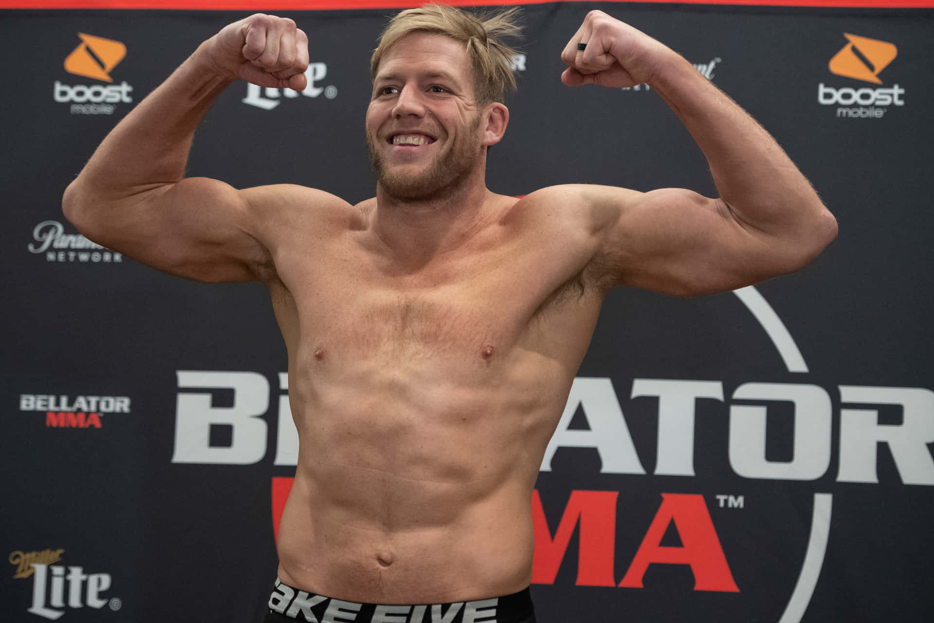Jake Hager Flexing During Bellator 214 Background