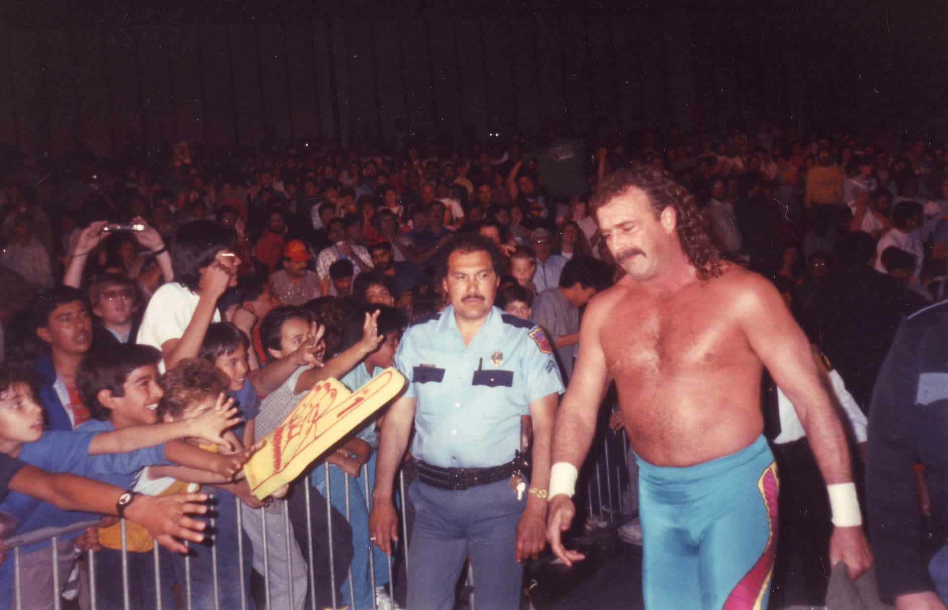 Jake Roberts Entering The Ring In The Late 1980s Background