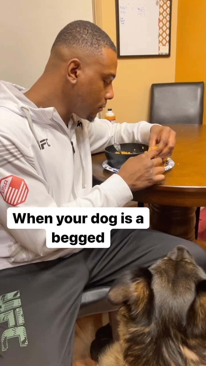 Jamahal Hill Eating With Dog Background