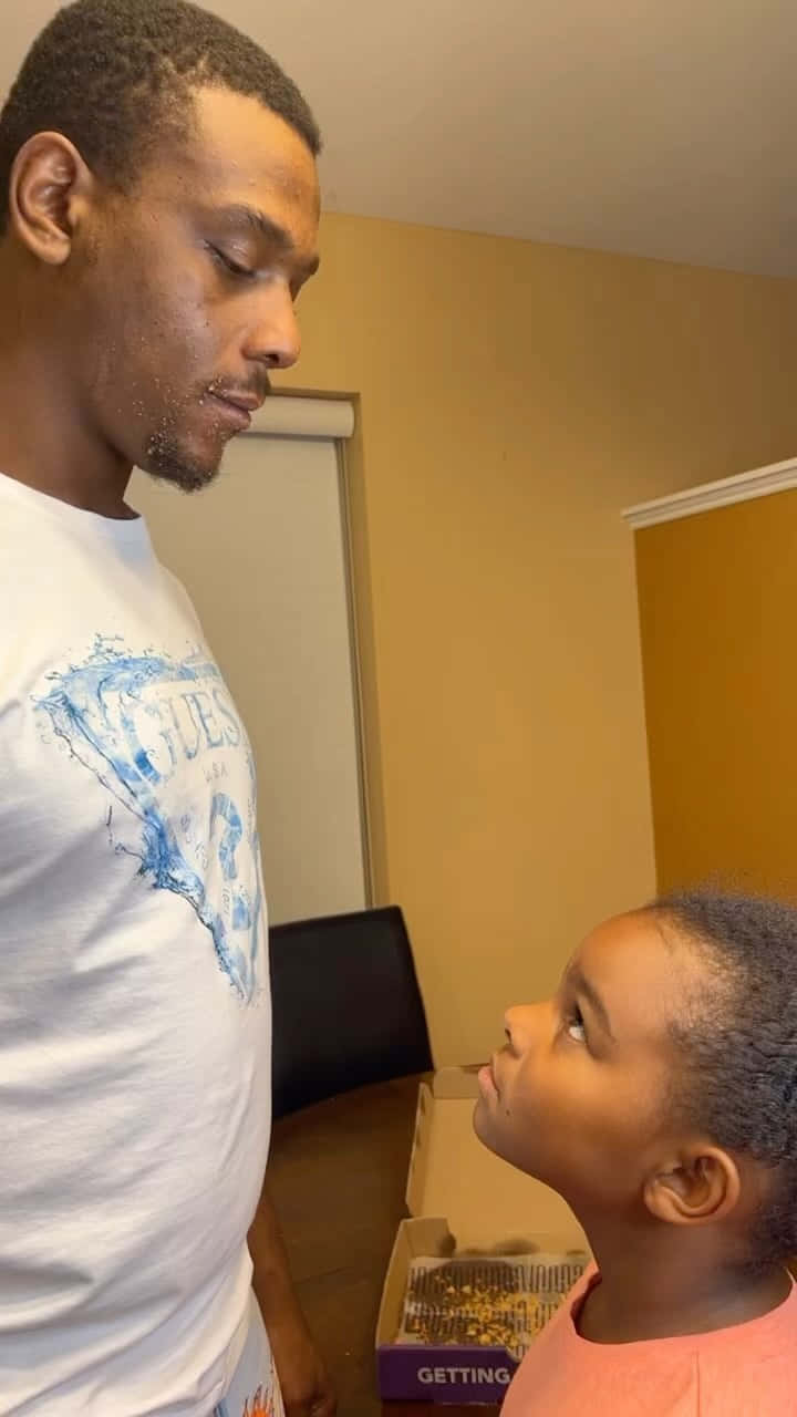 Jamahal Hill Looking At His Kid Background