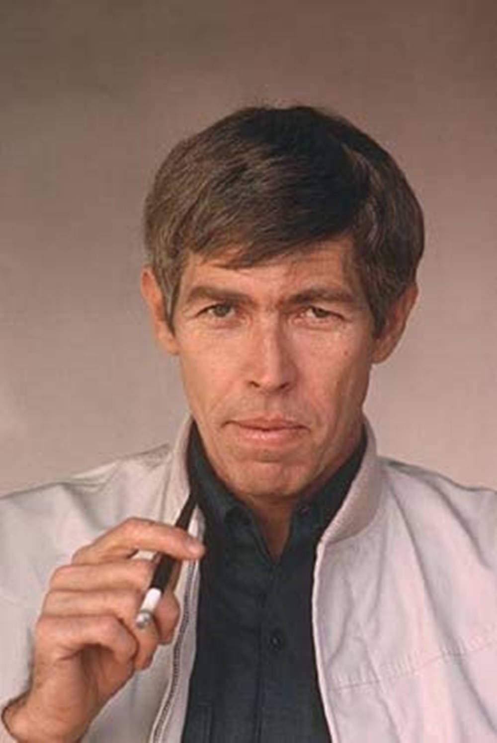 James Coburn With A Cigarette On A Filter