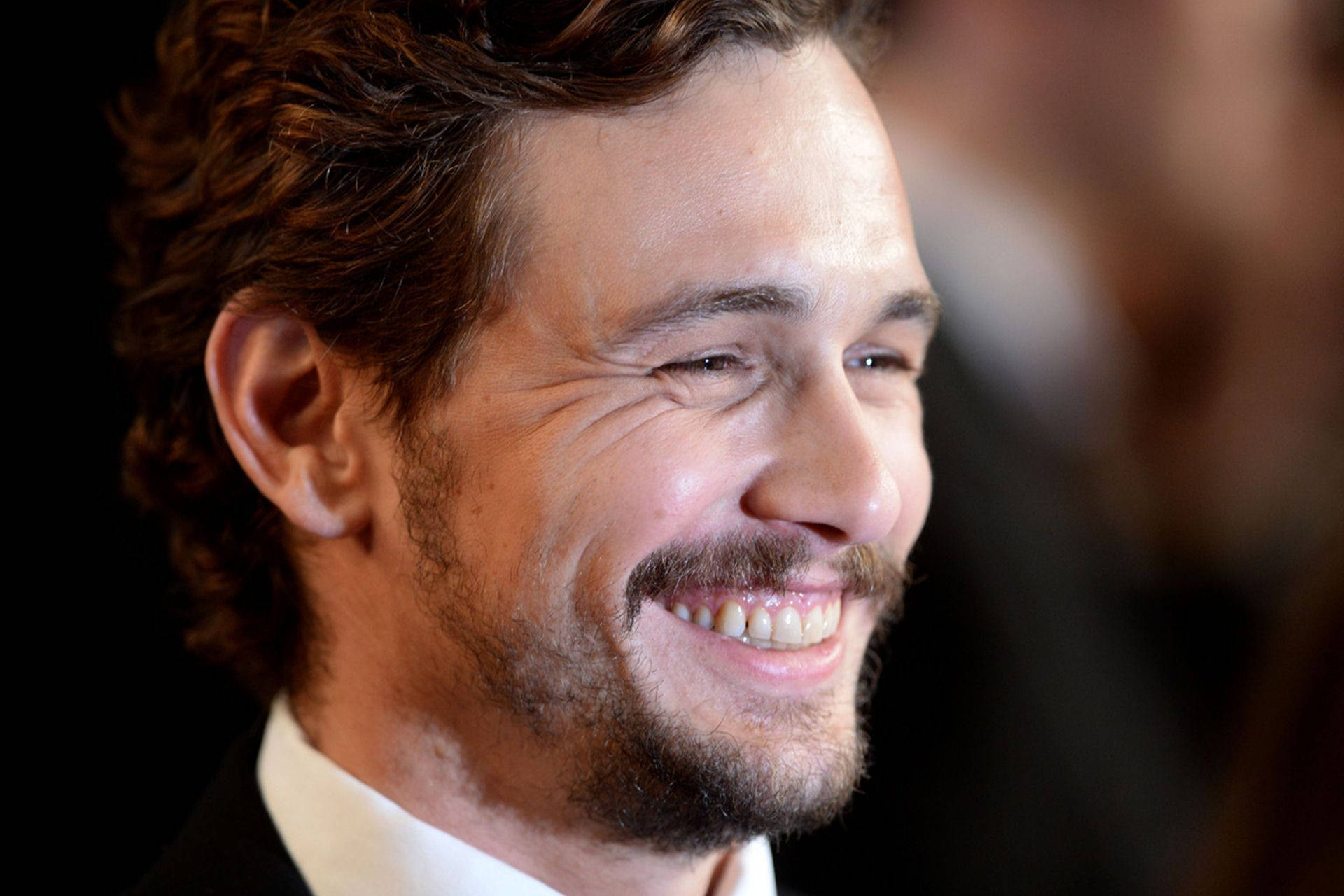 James Franco Spotlight Smiling Background