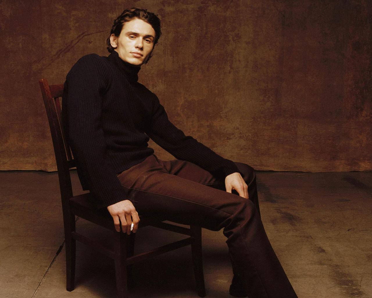 James Franco Wearing A Black Turtleneck In A Brown Room Background