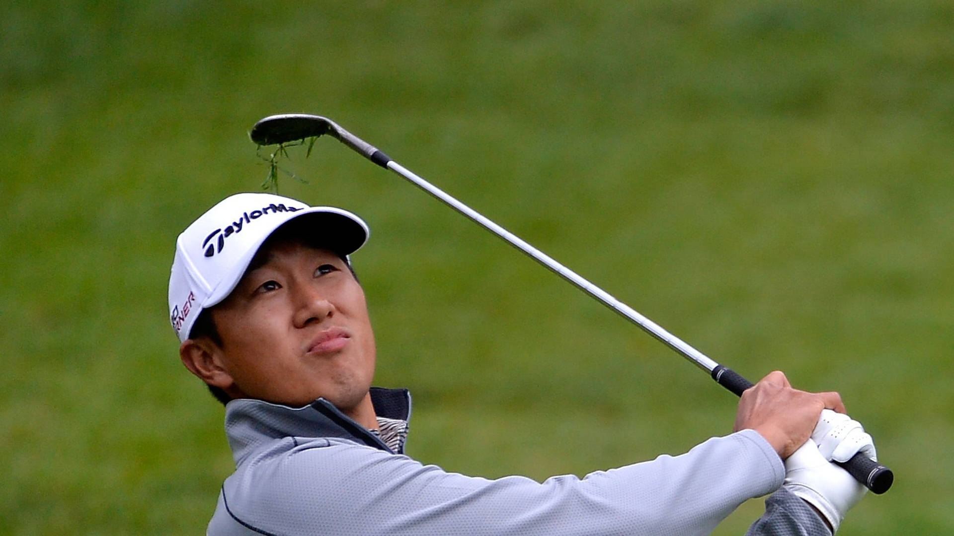 James Hahn Holding Golf Club Up Background