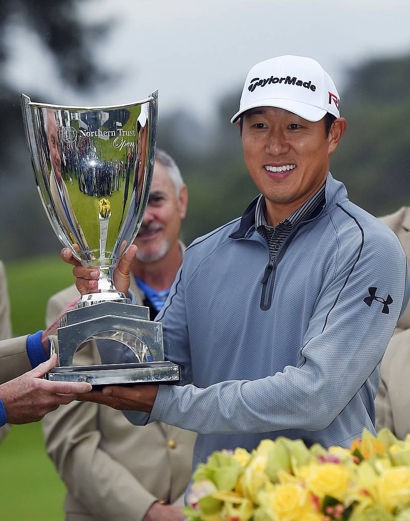 James Hahn Holding His Trophy Background