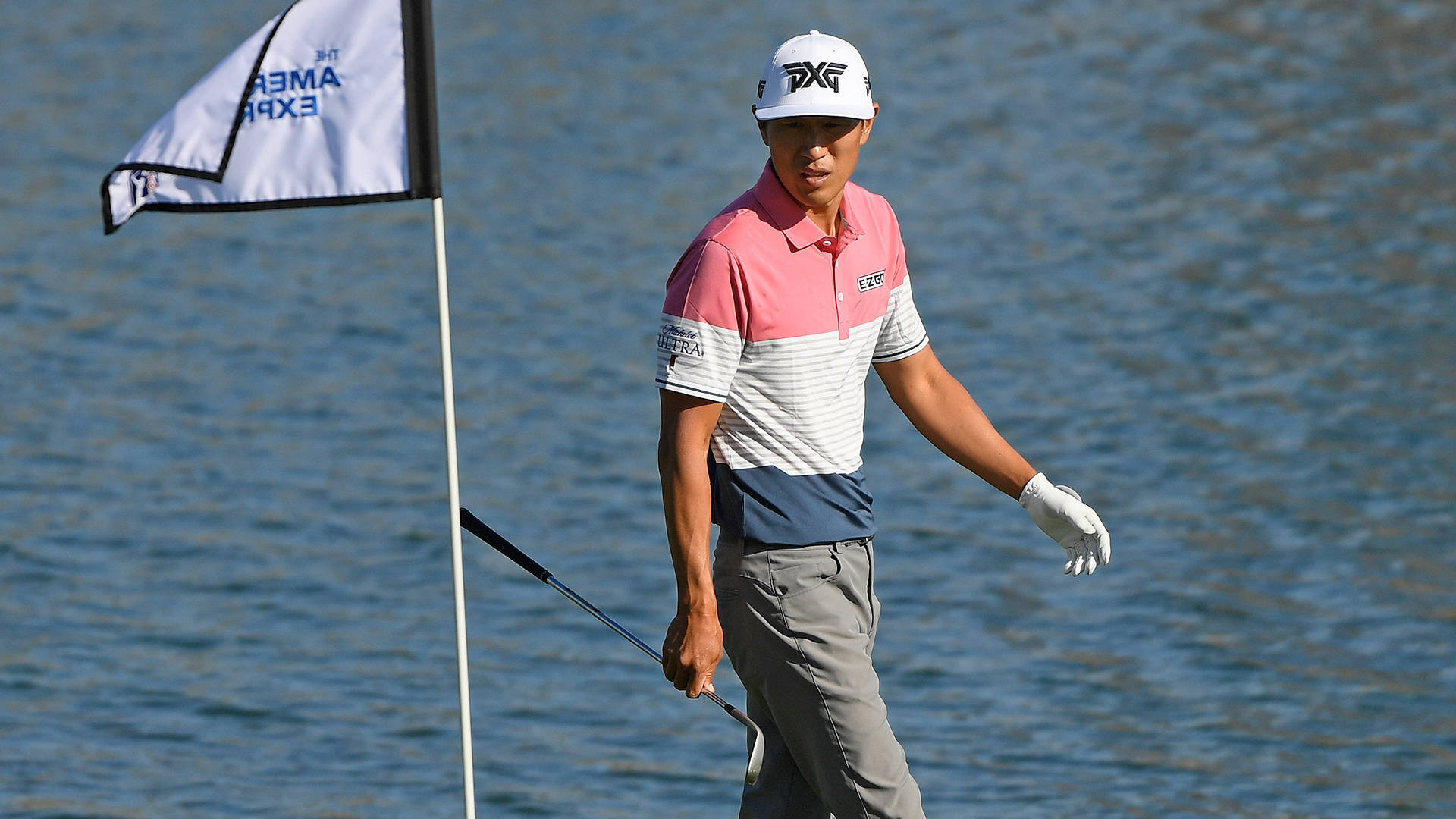 James Hahn Walking Against Lake Background