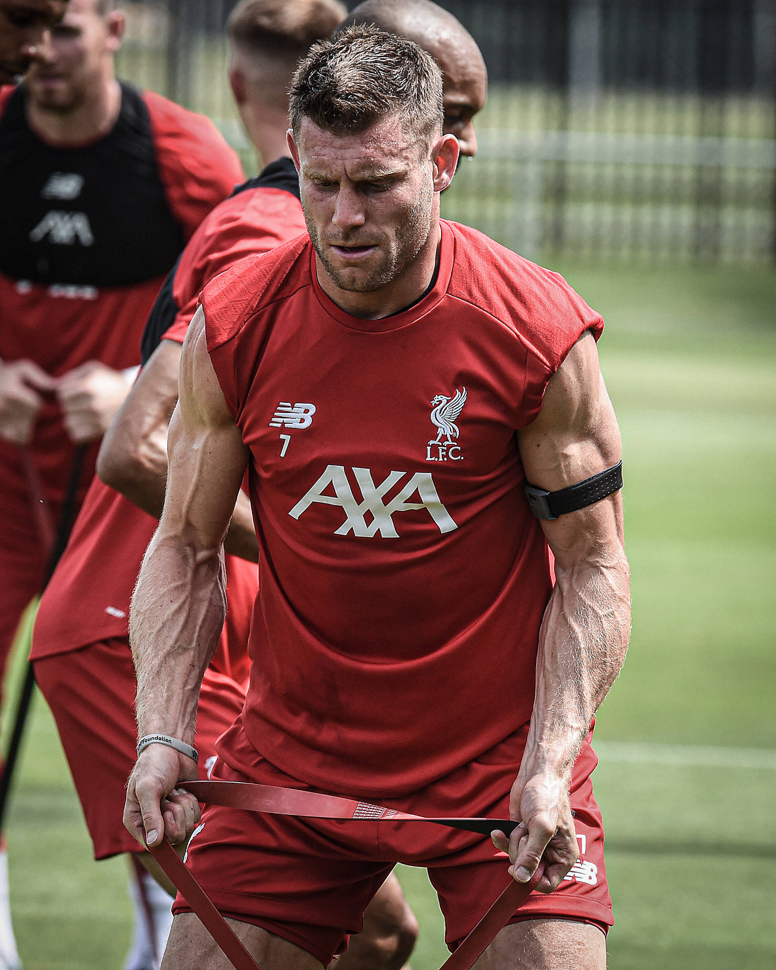 James Milner Engaged In Intense Football Training Session Background