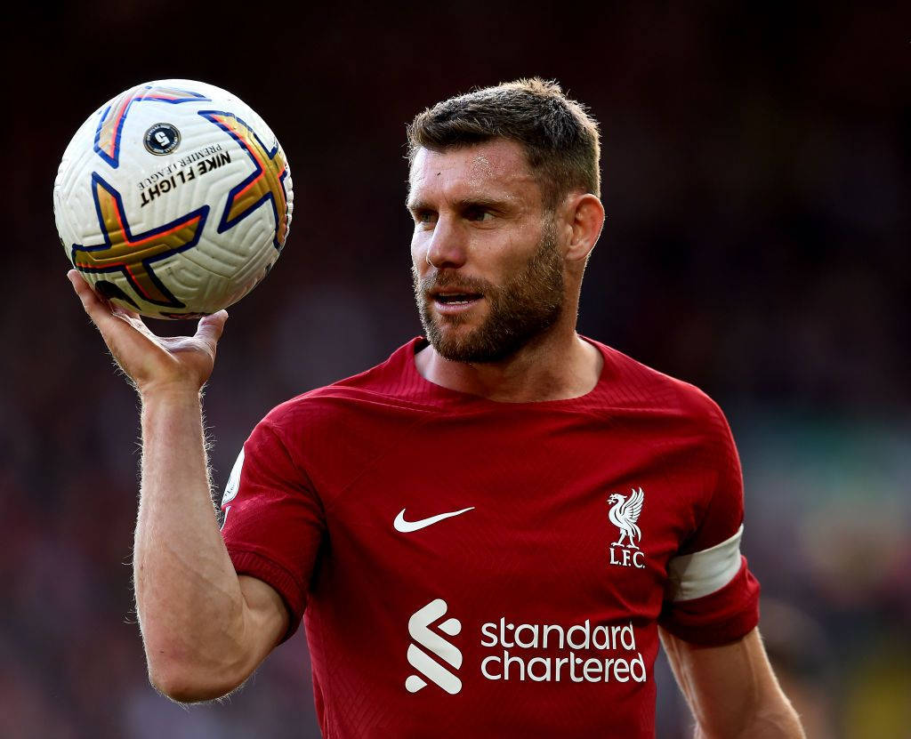 James Milner Holding Ball Up Background