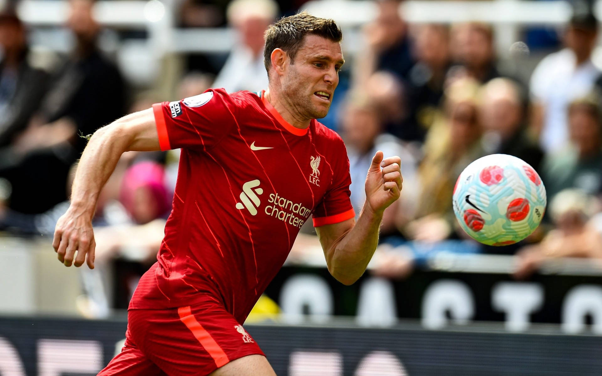 James Milner Running With Ball Background