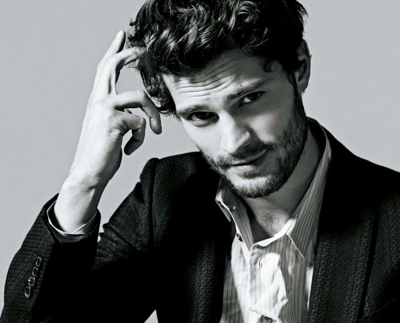 Jamie Dornan Looking Dapper In A Suit Background