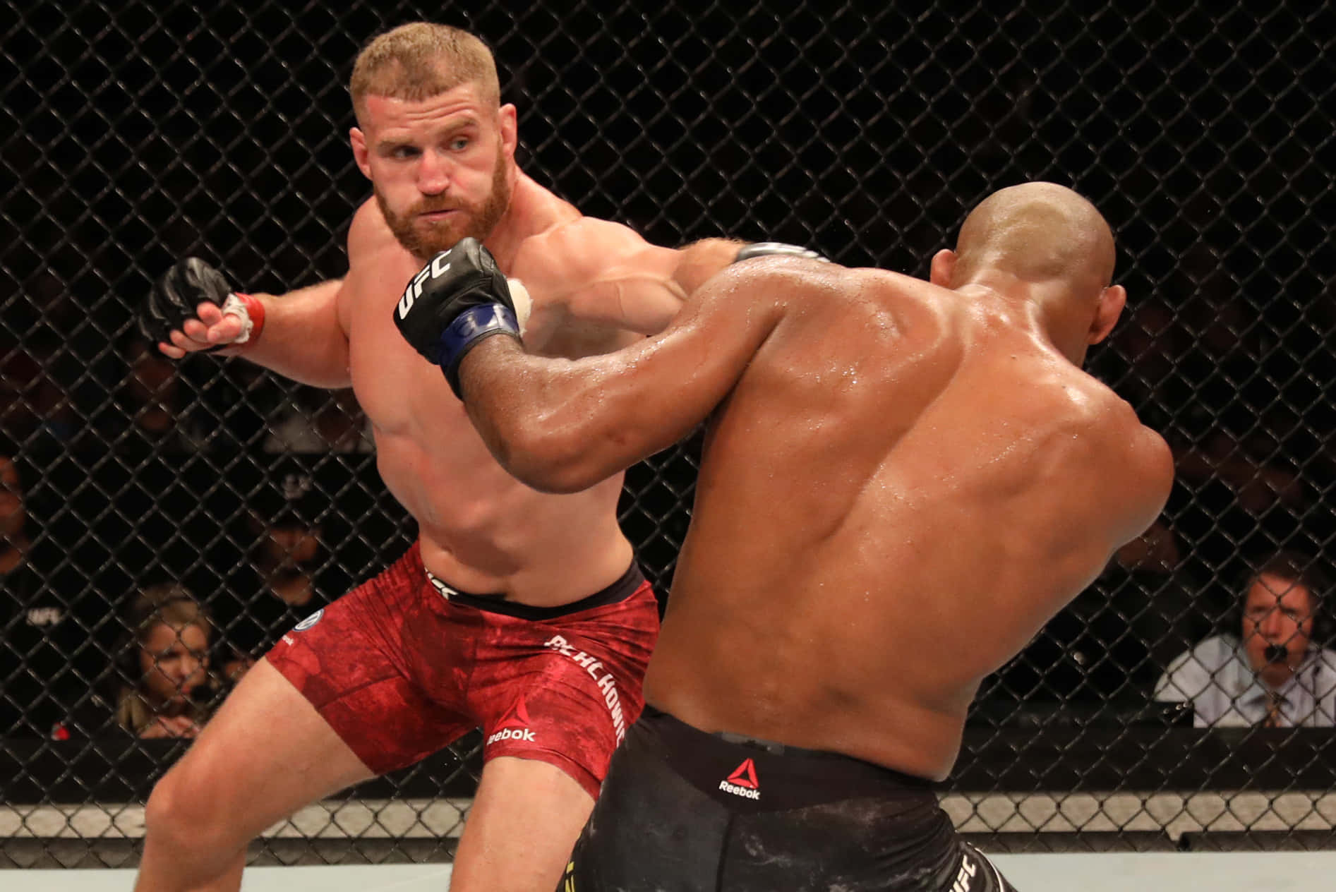 Jan Blachowicz Giving Punch Ronaldo Souza Background