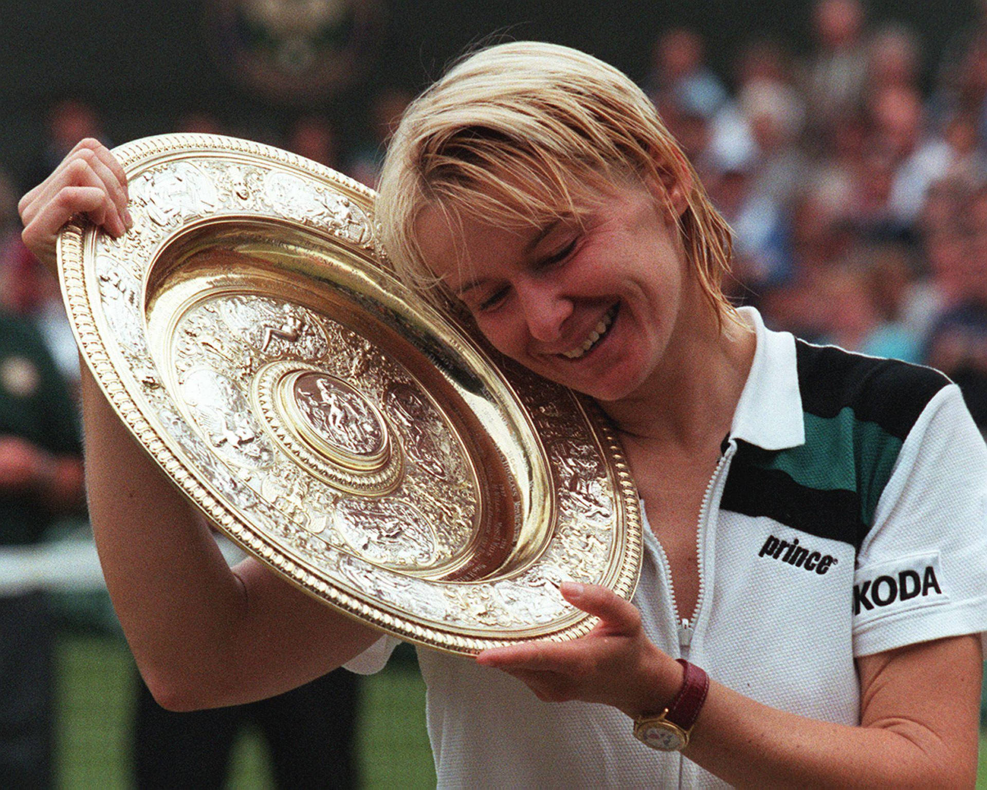 Jana Novotna Holding Trophy With Joy Background