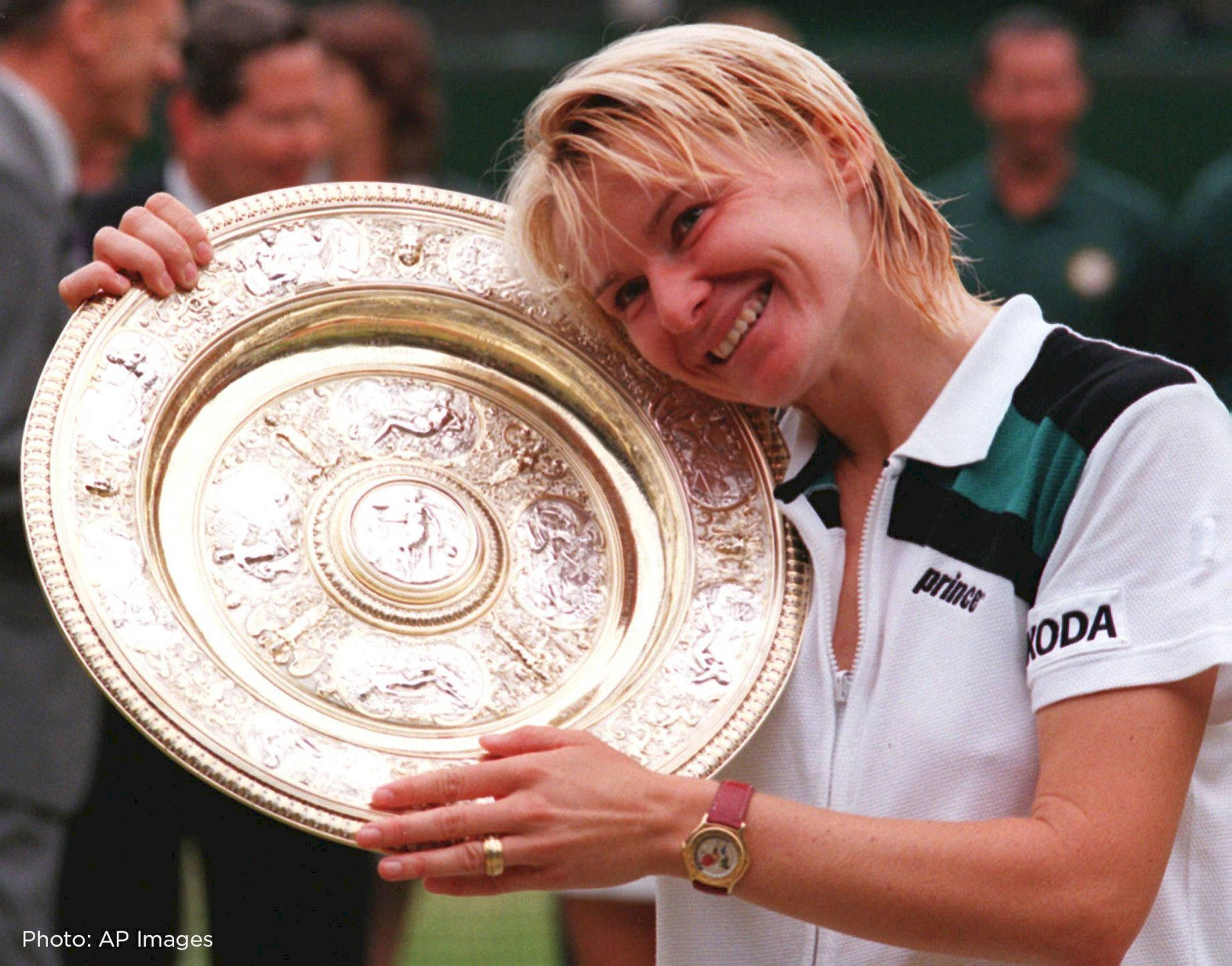 Jana Novotna Resting On Wimbledon Trophy Background