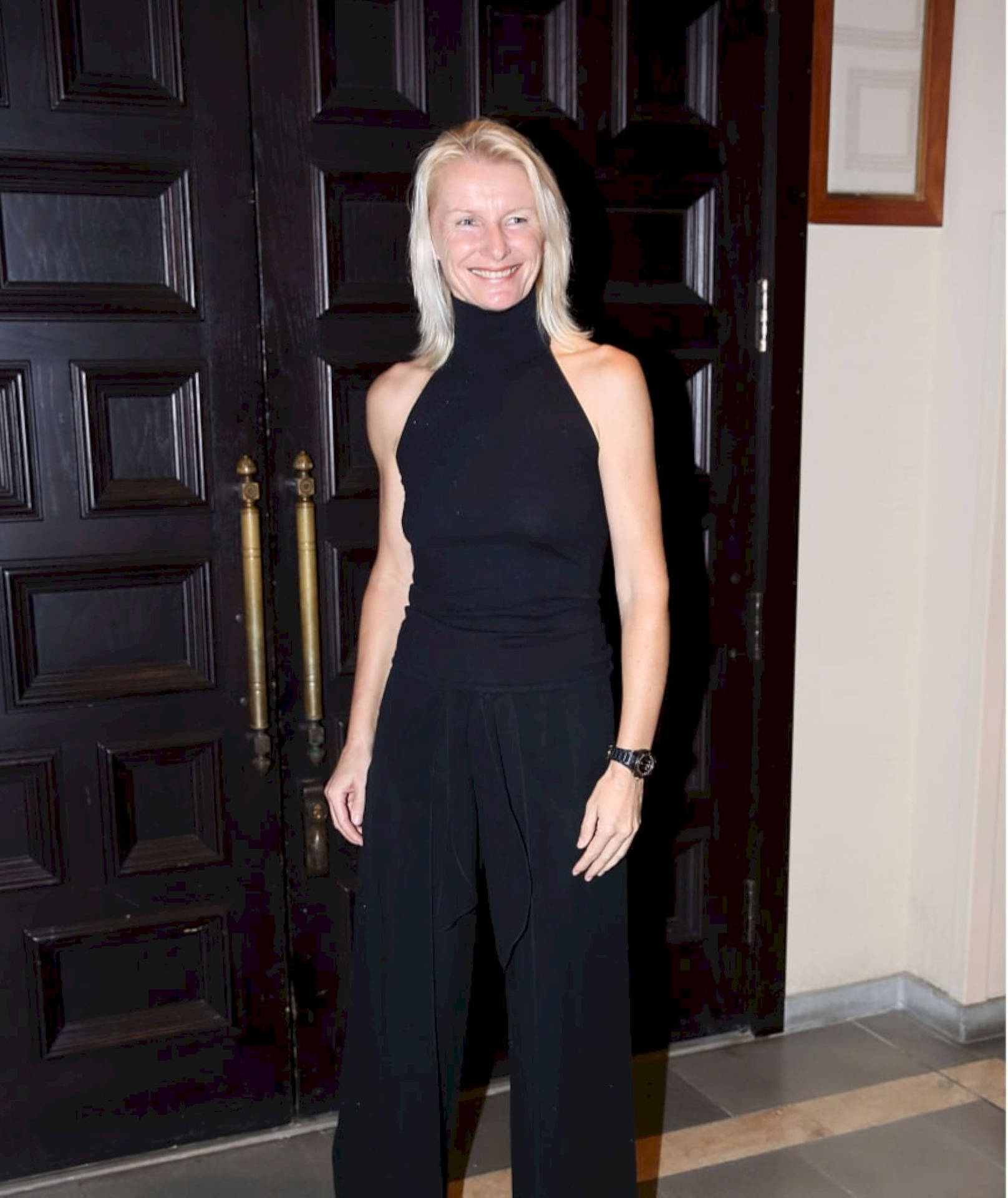 Jana Novotna, Tennis Legend, Dressed Elegantly In Black Background