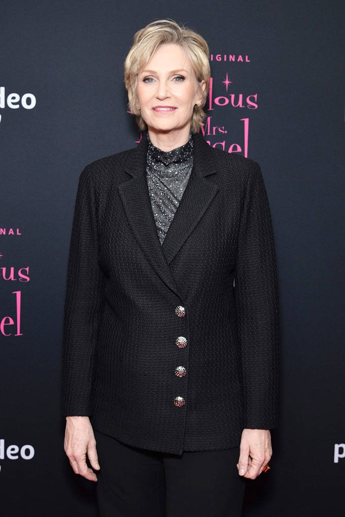 Jane Lynch Black Coat Background