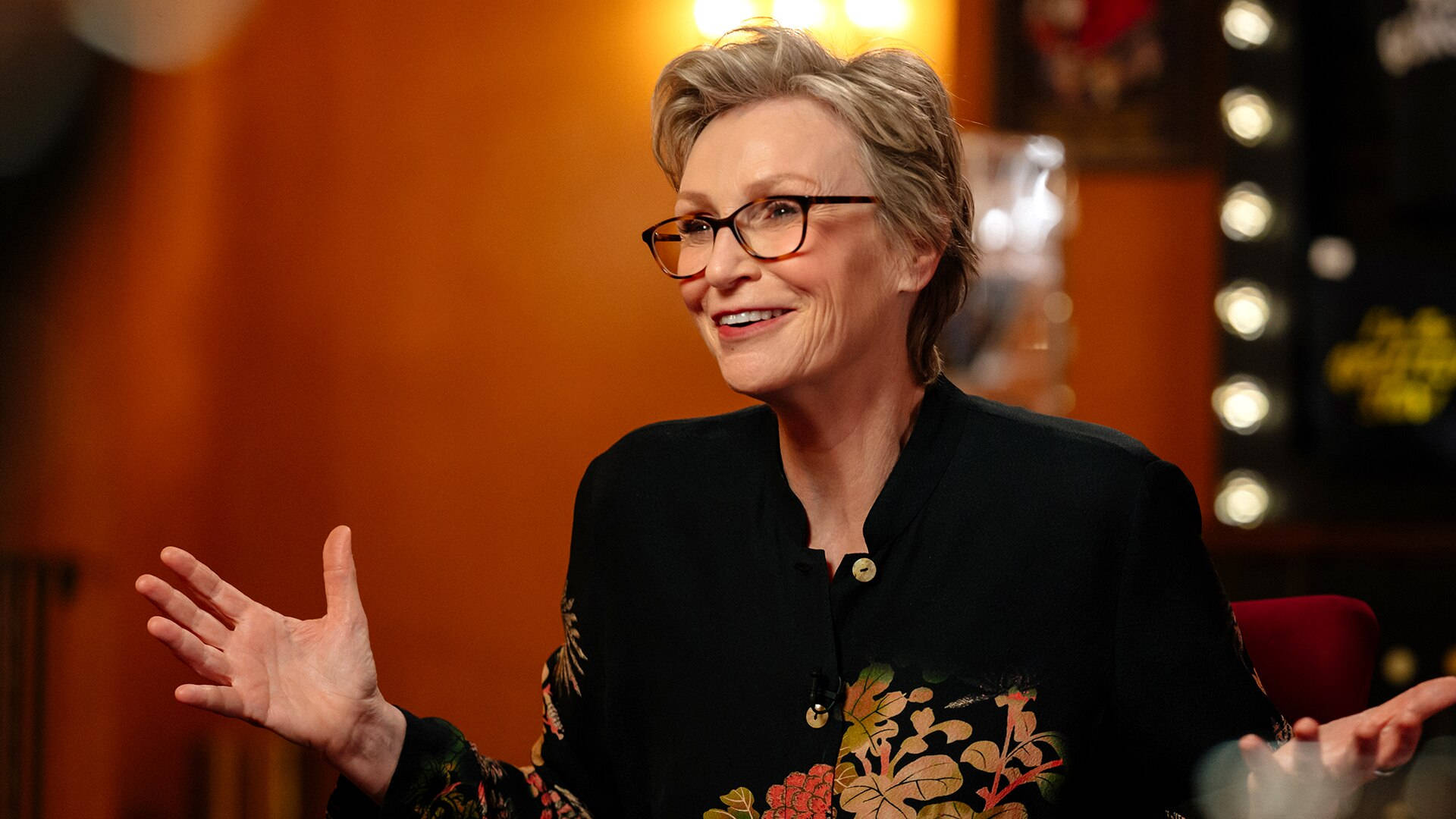 Jane Lynch On A Talk Show Smiling