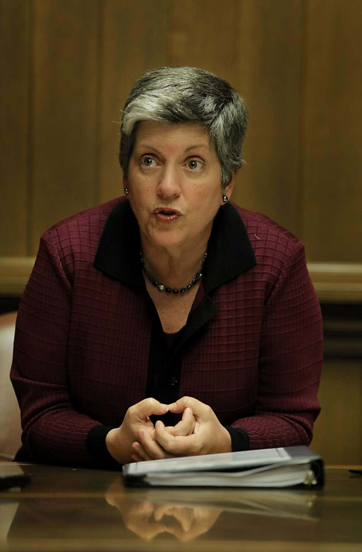 Janet Napolitano In Maroon Blazer Background