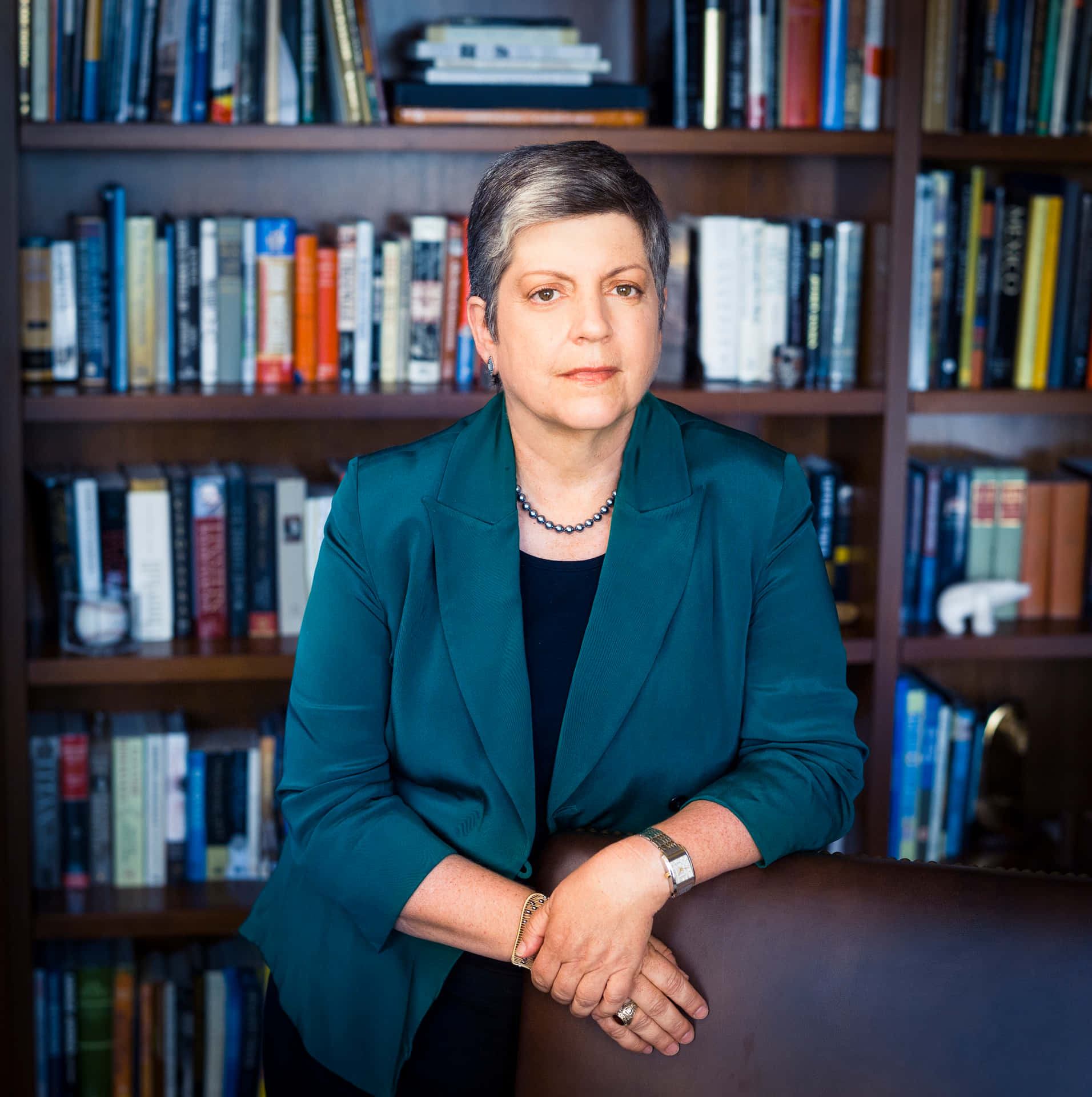 Janet Napolitano Near Book Shelf Background