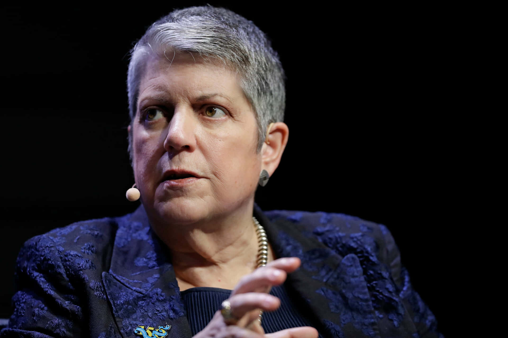 Janet Napolitano On Black Backdrop Background