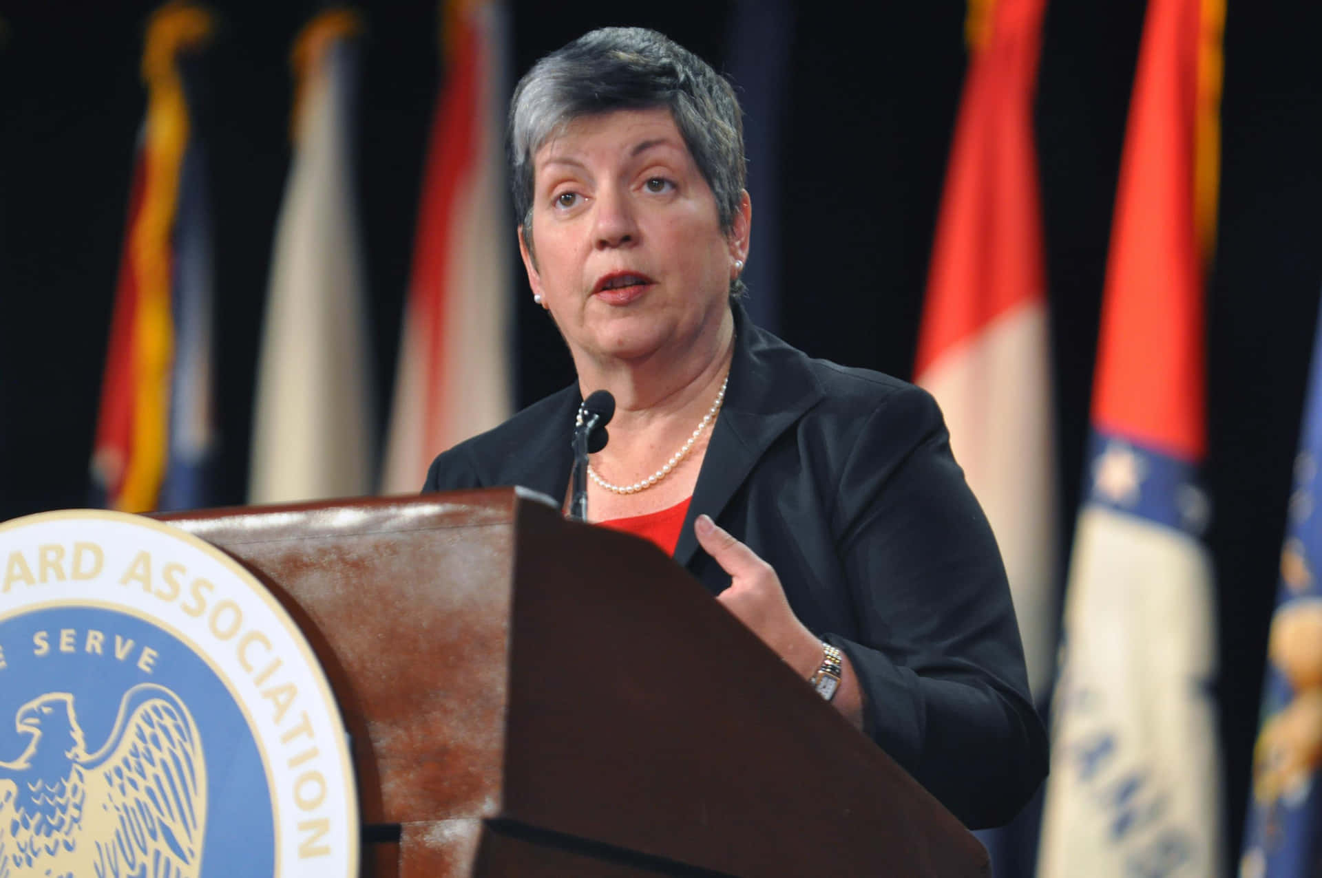 Janet Napolitano On Podium Background