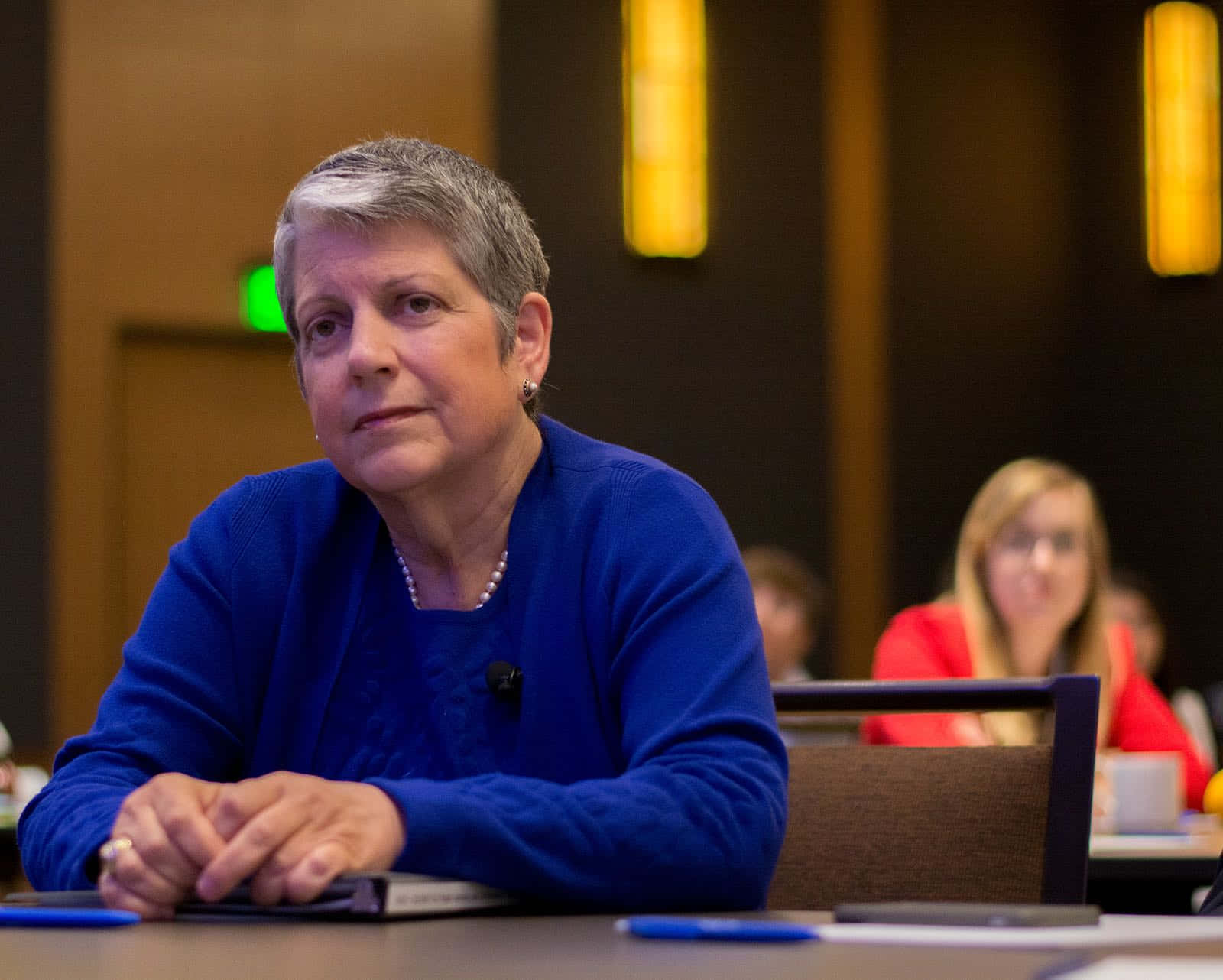 Janet Napolitano Sitting On Chair Background