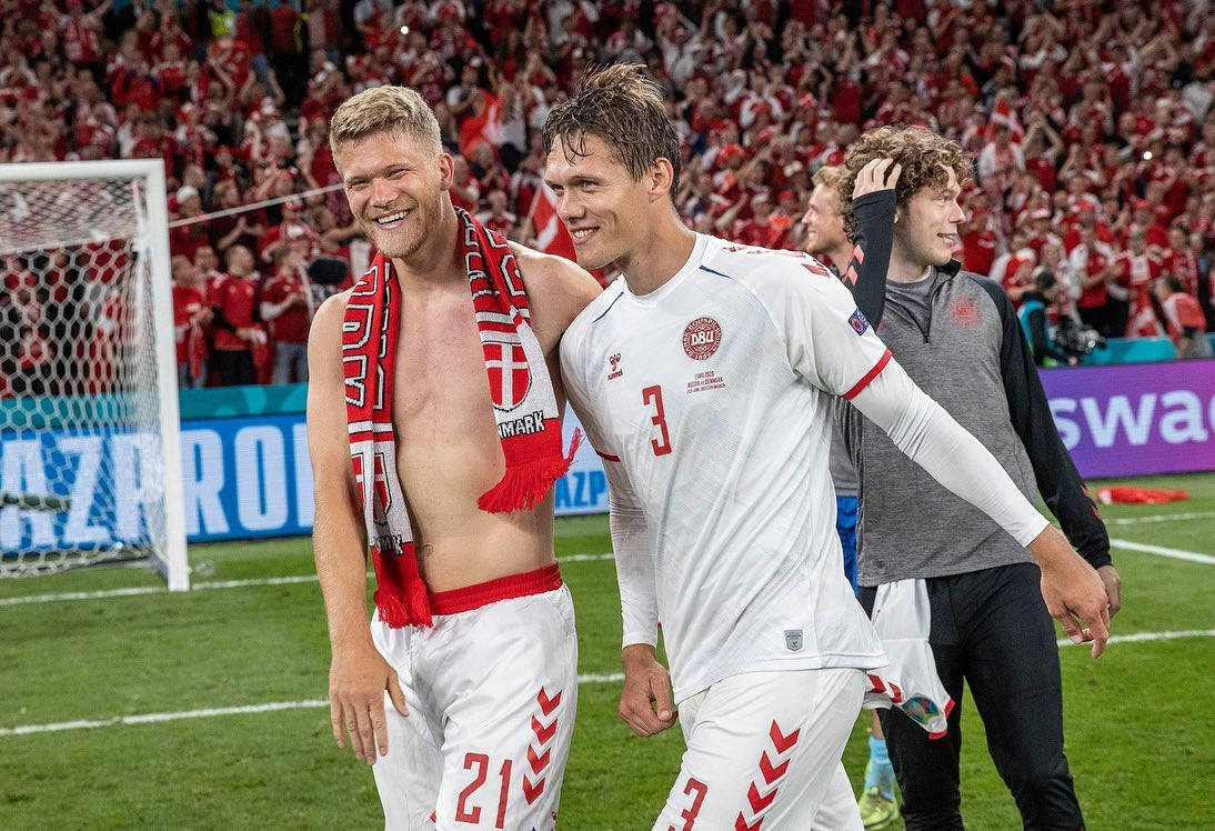 Jannik Vestergaard Next To Shirtless Teammate Background