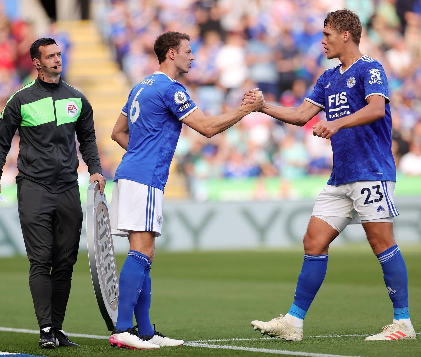 Jannik Vestergaard Shaking Hands With Teammate Background