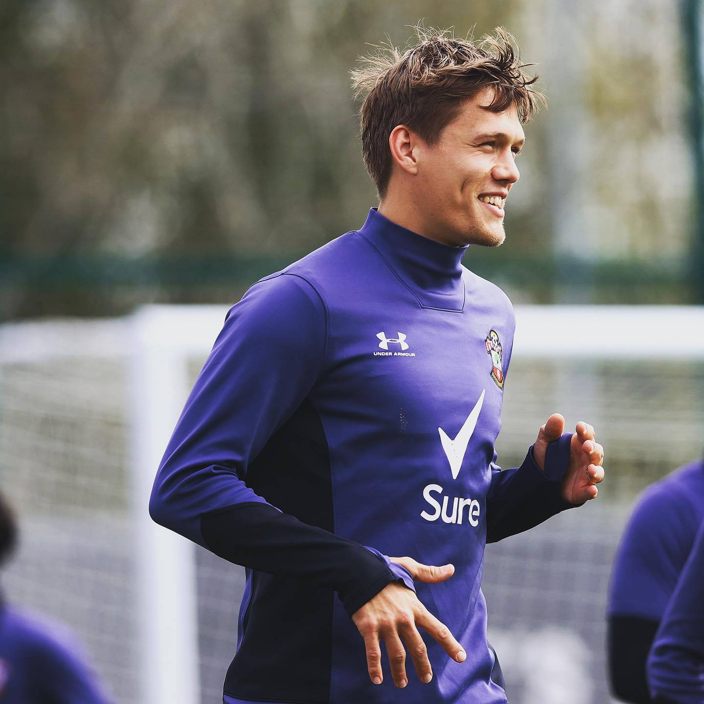 Jannik Vestergaard Smiling While Running Background