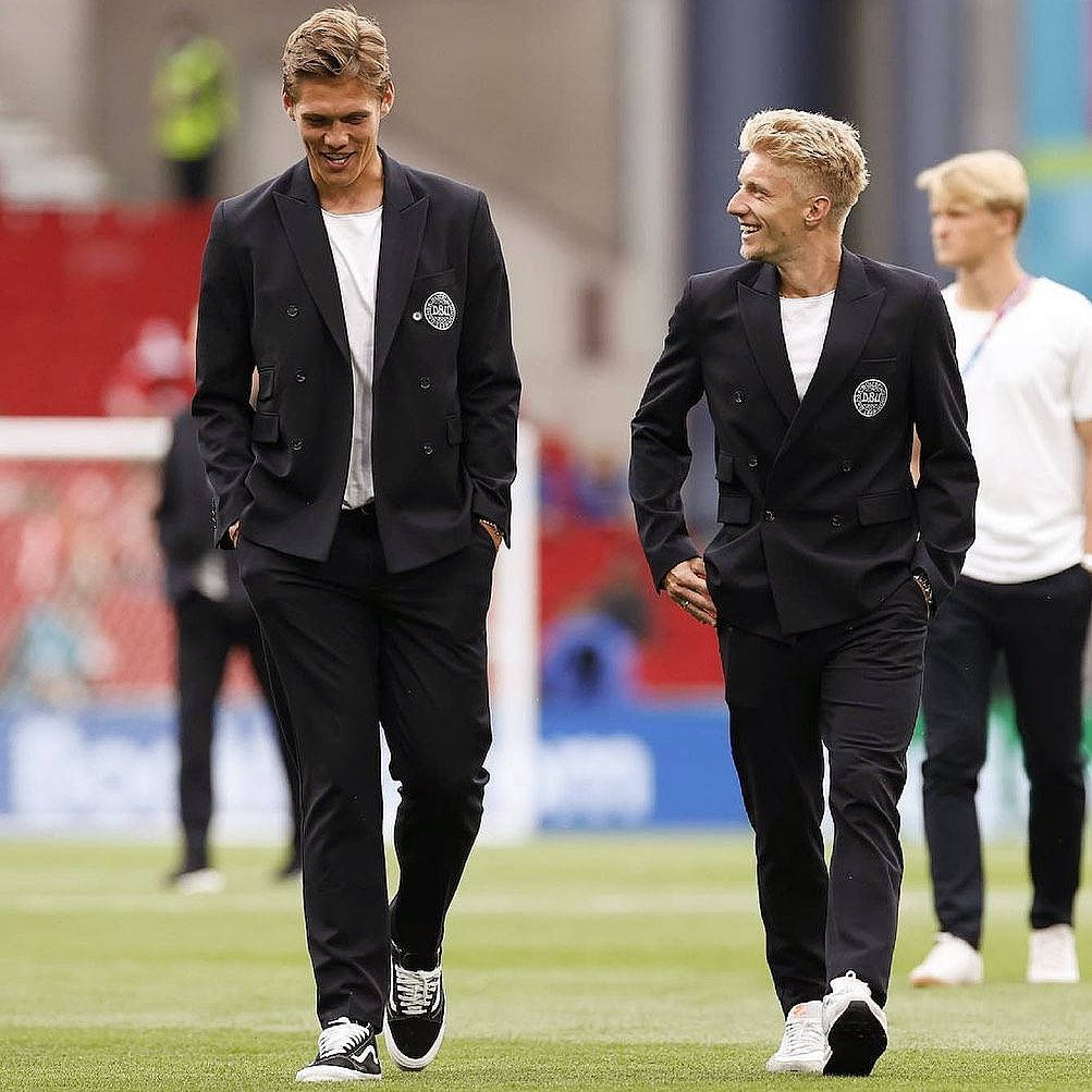 Jannik Vestergaard Walking With Teammate Background