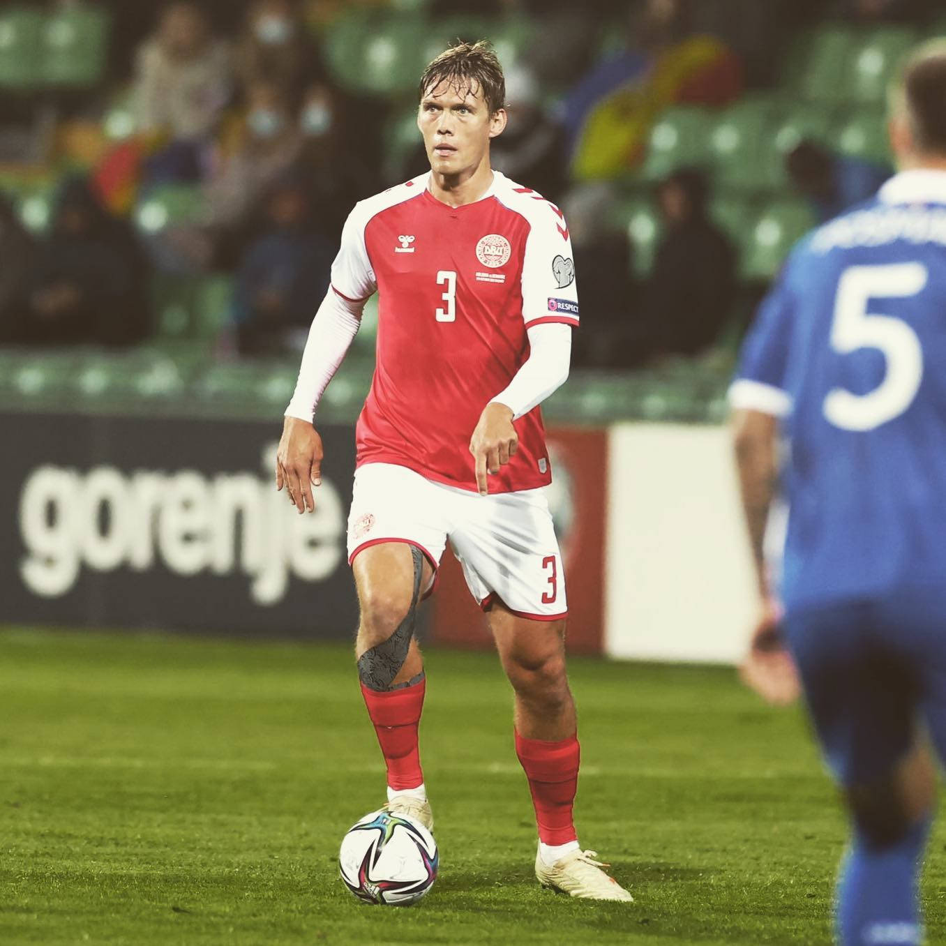 Jannik Vestergaard Wearing Red And White Background