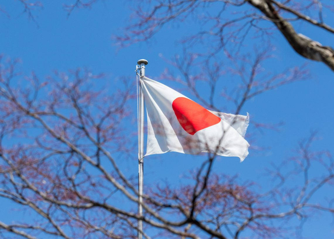 Japan Flag With Blue Sky View Background
