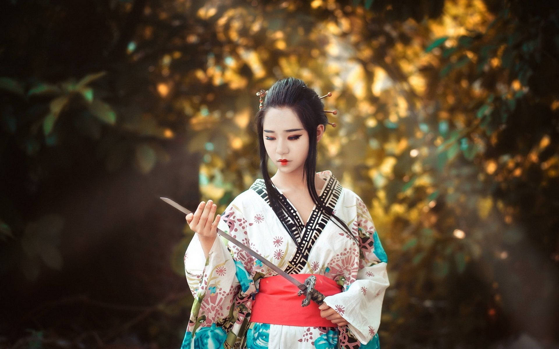 Japan Girl In A Kimono With A Sword Background
