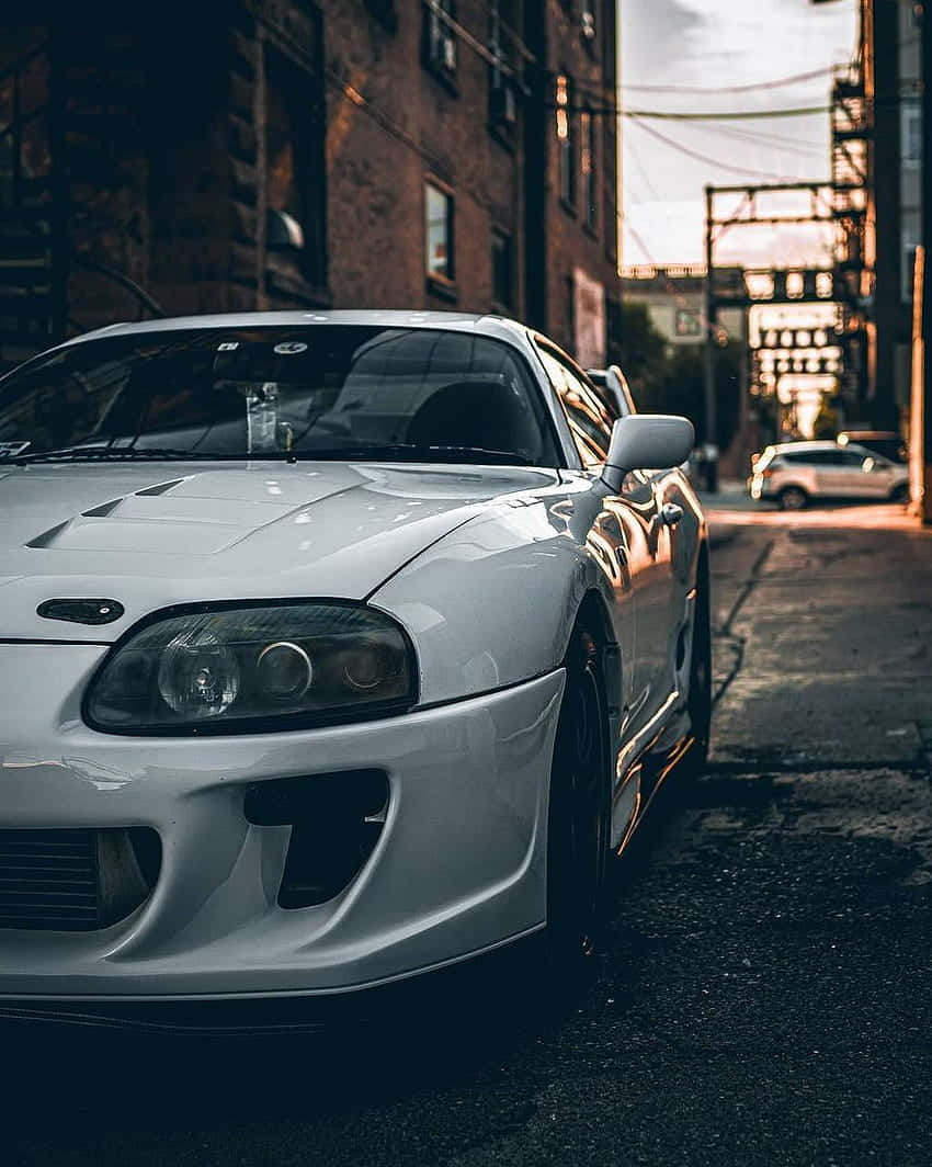 Japanese Domestic Market (jdm) Supra Taking Over The Streets Background