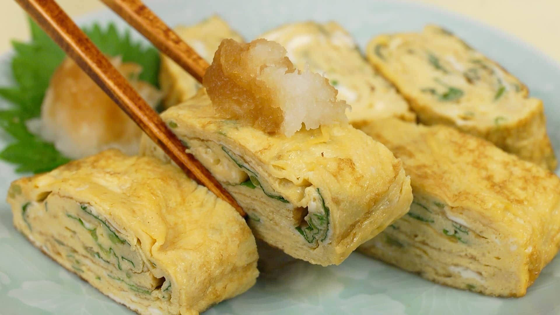 Japanese Egg Roll With Chopsticks Background