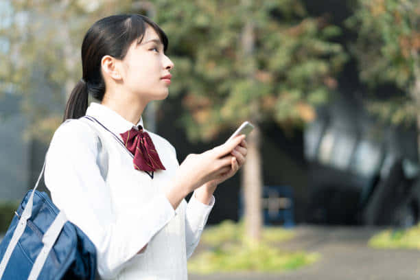 Japanese School Girl In Park Background