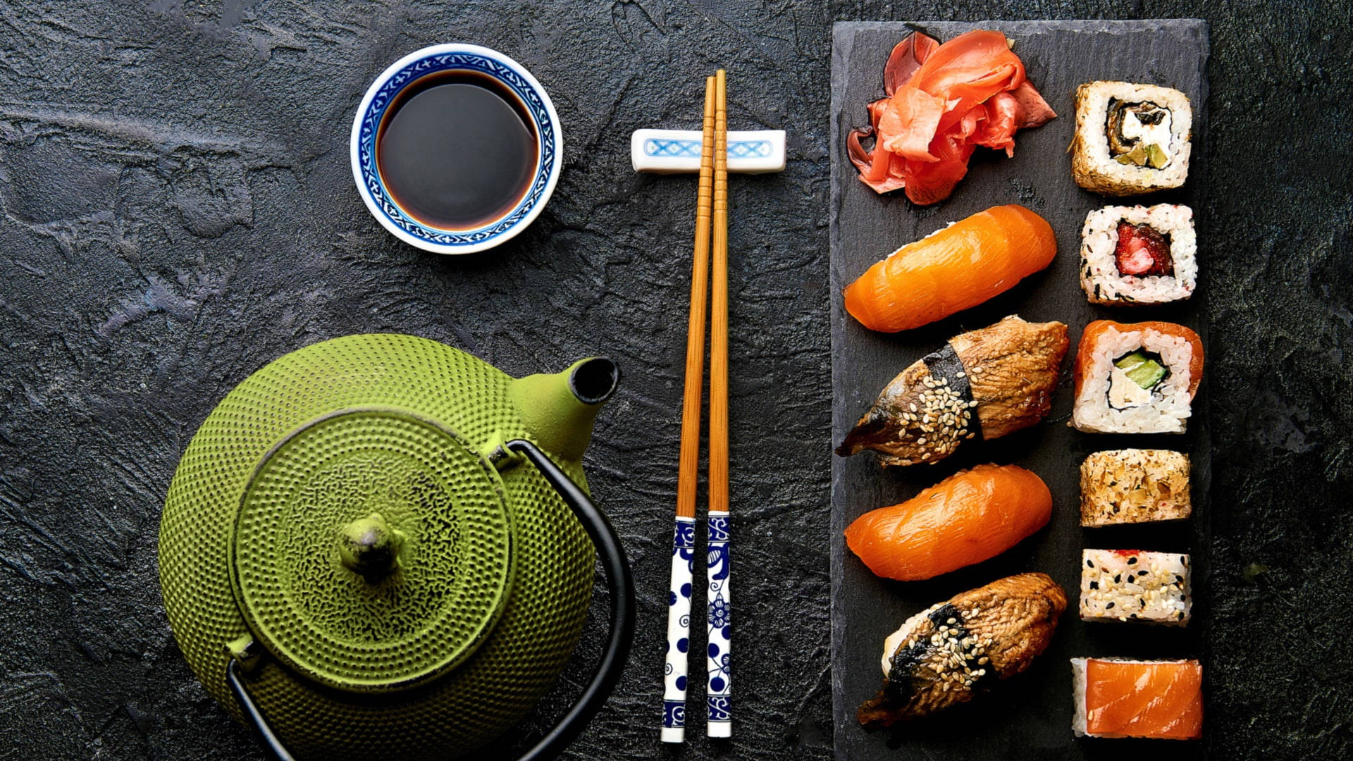 Japanese Sushi With Green Teapot Background