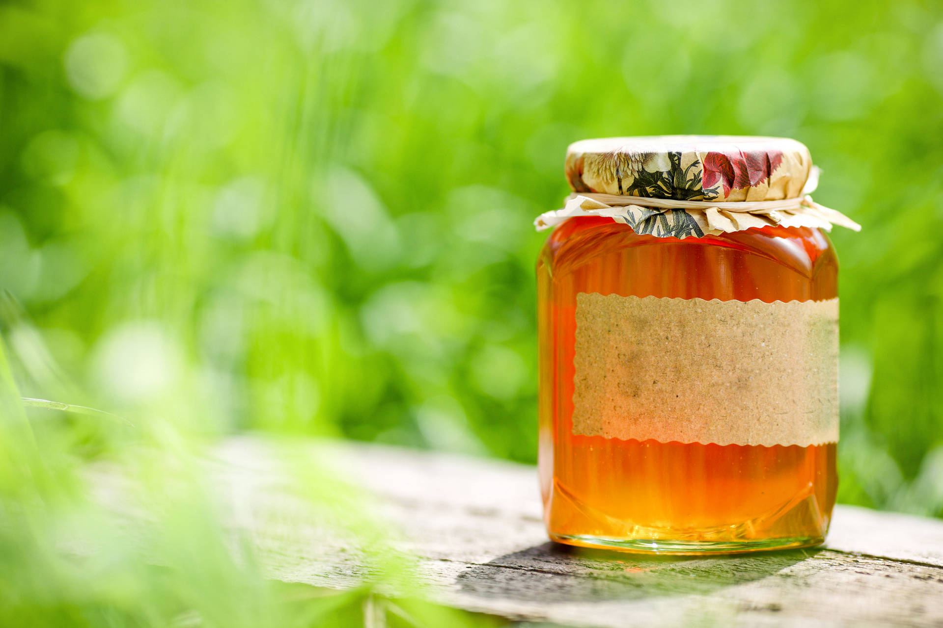 Jar Of Fresh Honey On Plank Background