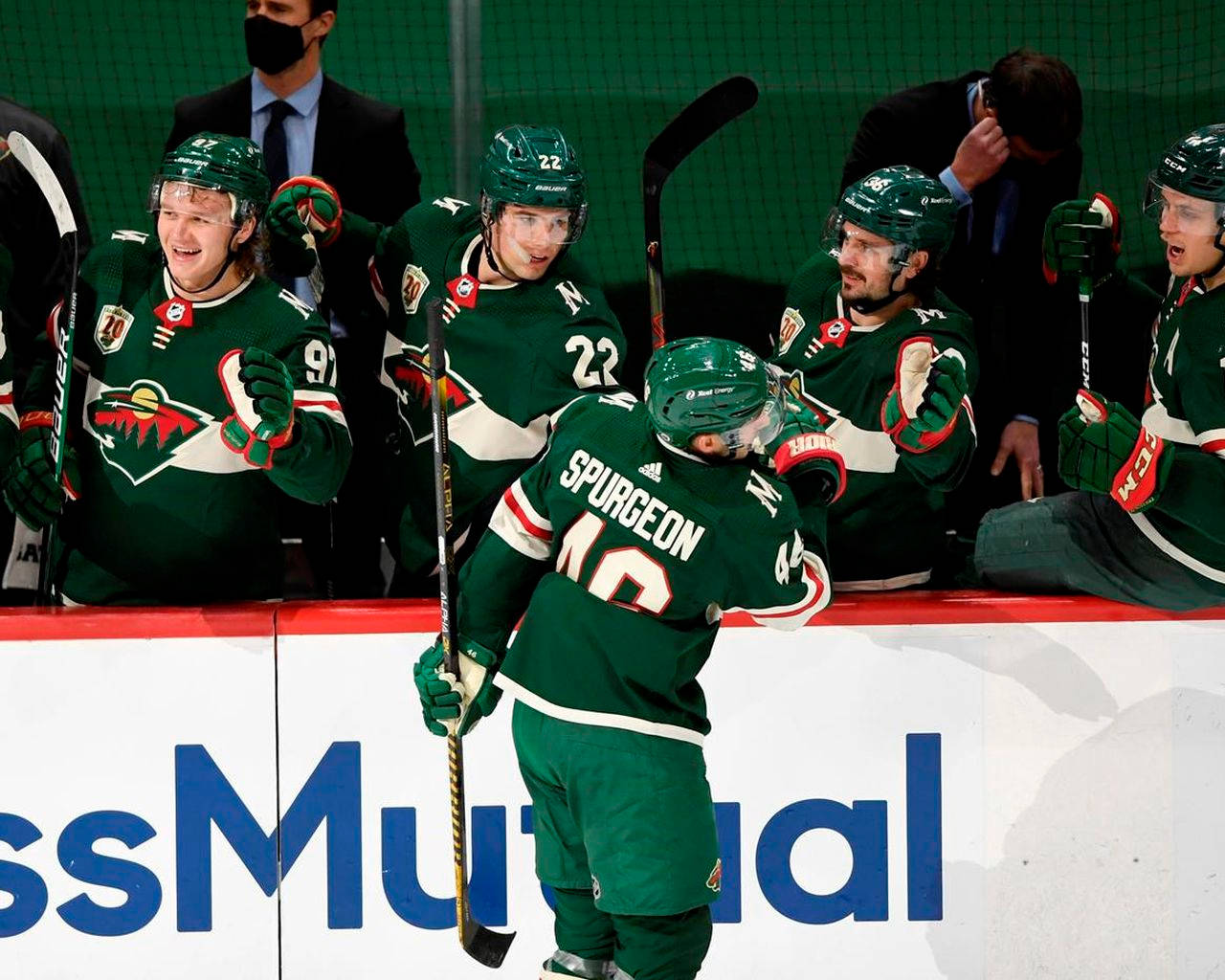 Jared Spurgeon Celebrating On The Hockey Bench After A Successful Play Against The Philadelphia Flyers. Background