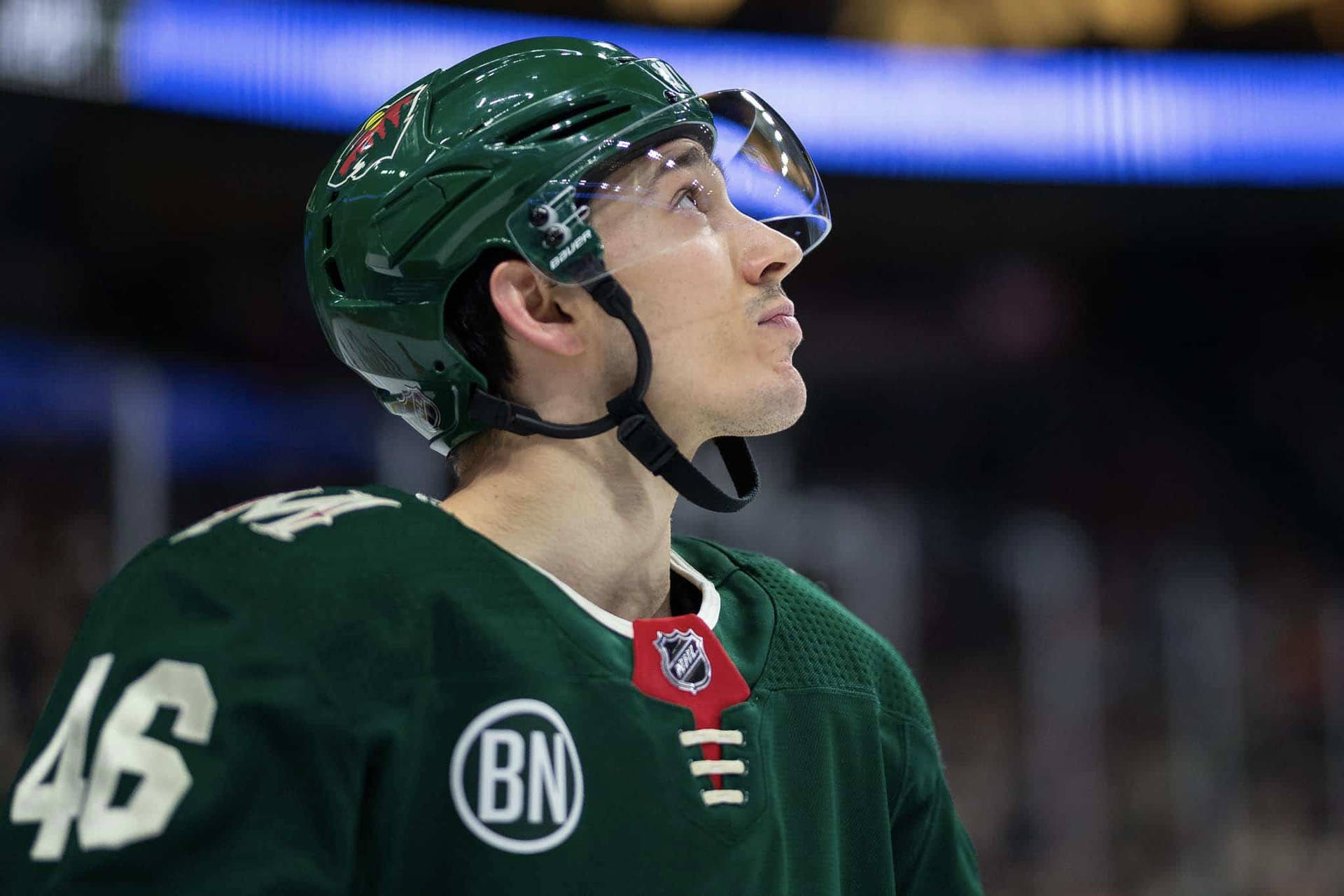 Jared Spurgeon In Action At The Xcel Energy Center. Background